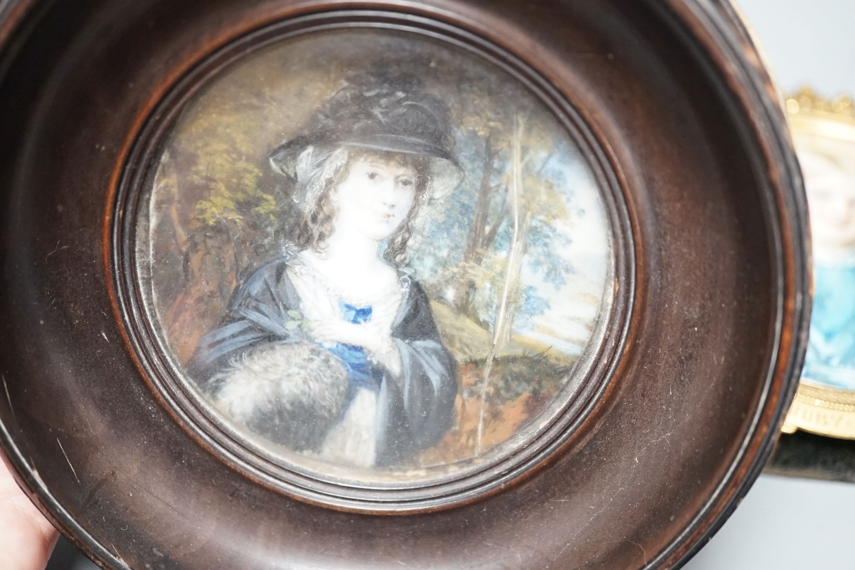 A late 19th century portrait miniature on ivory of a girl, ‘Ruby, 1875’, together with another (2)